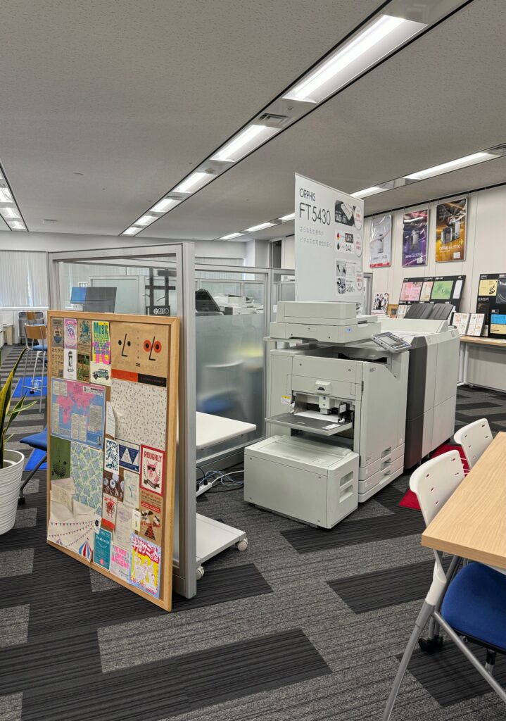 The view of an office with carpeting and drop ceilings