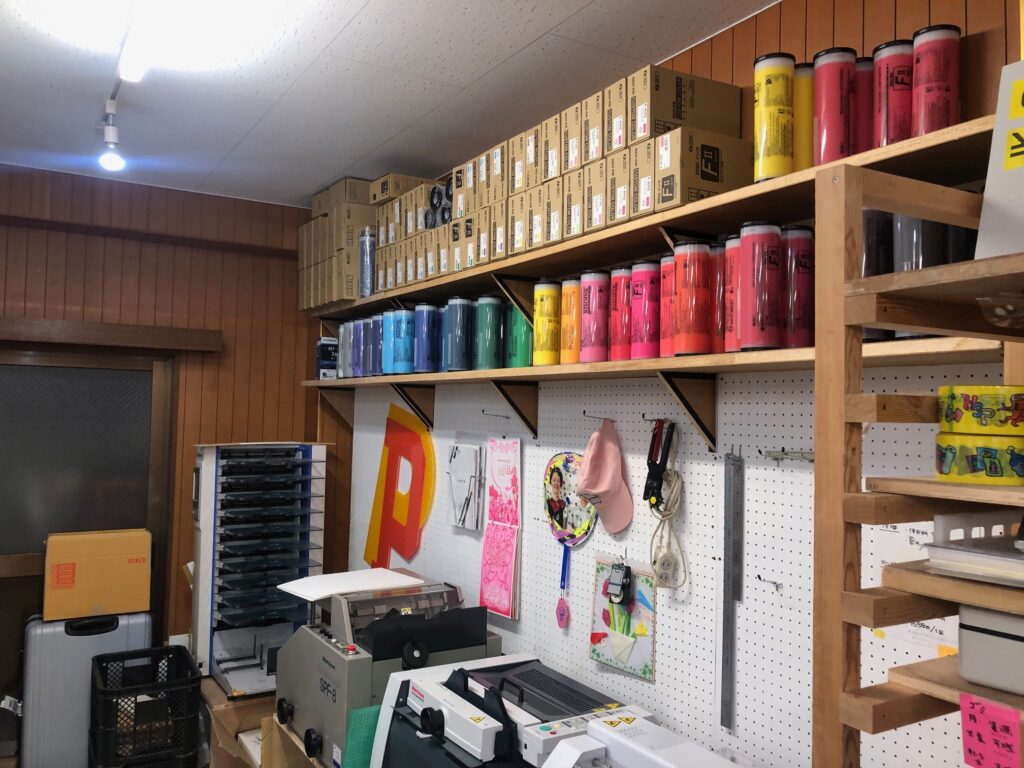 Ink tubes lined up on a tall shelf